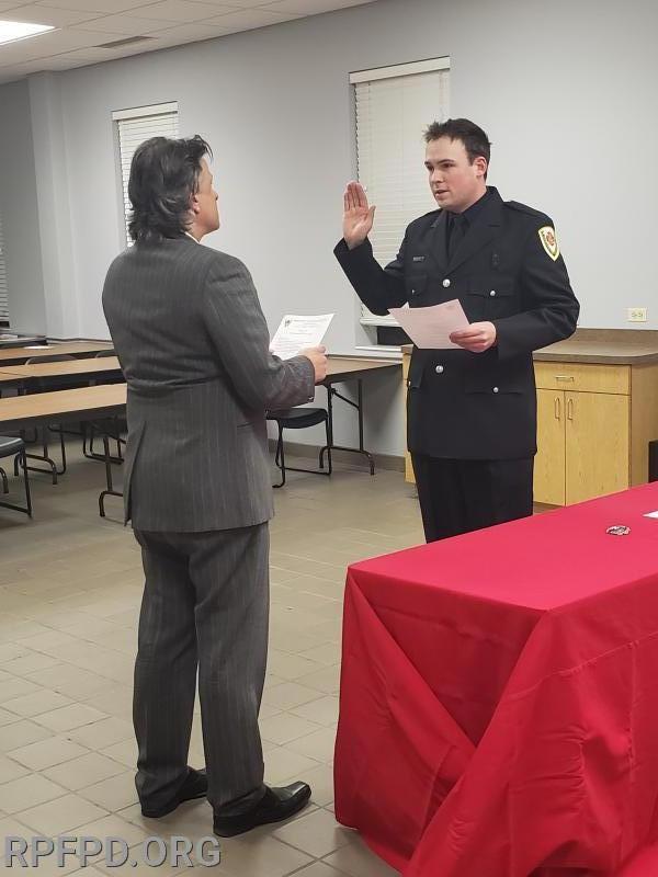 James Evans is sworn-in as Firefighter/Paramedic by Trustee Steve Stratakos on December 10, 2019. 